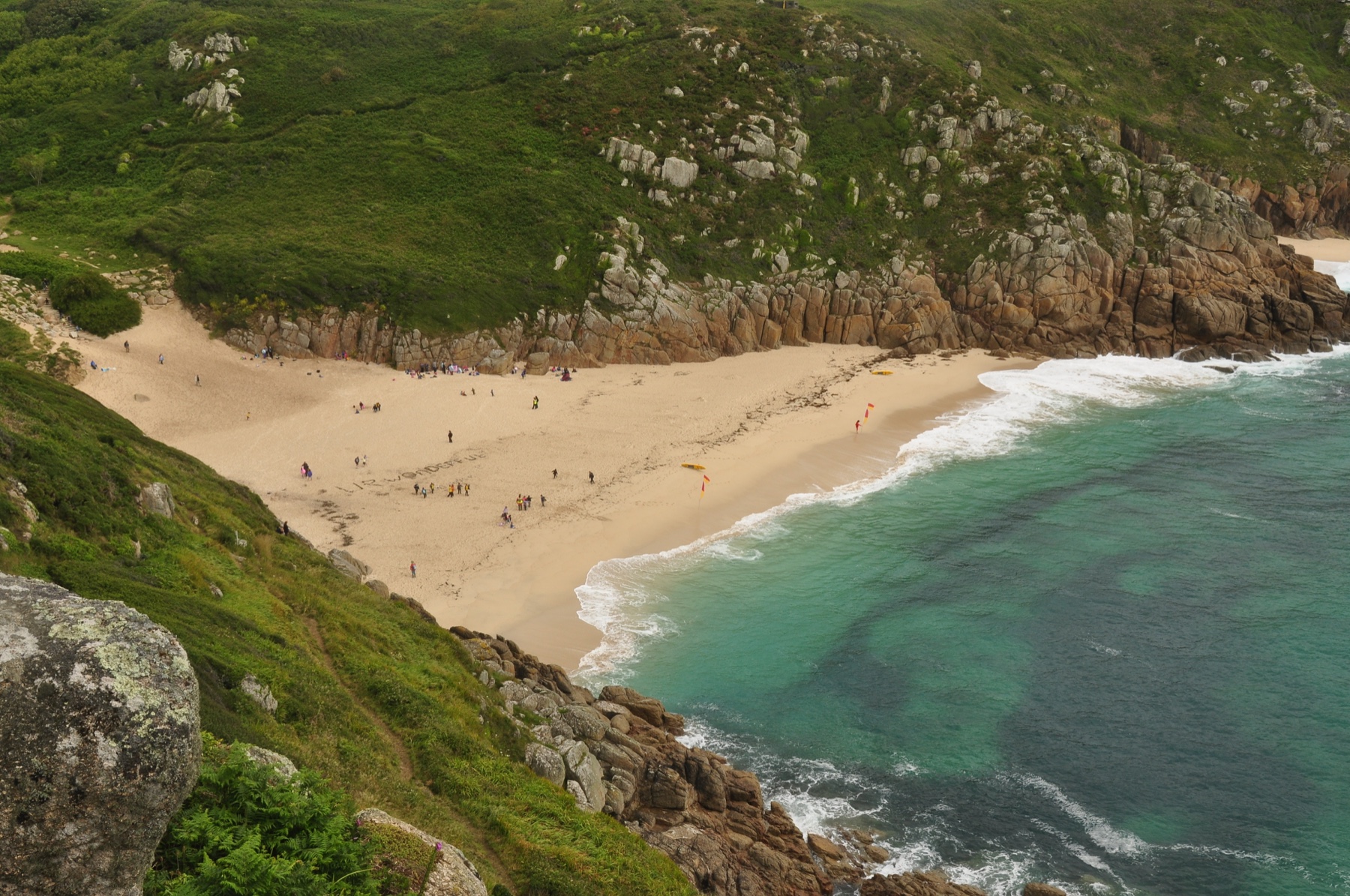 A Cornish beach and turquoise sea from the coastal path